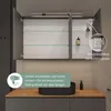 A bathroom vanity with a sink and a mirrored cabinet above it, featuring integrated lighting and an electrical outlet. Produktbild-Vorschau