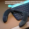 A neck speaker is placed on a desk next to a keyboard. Produktbild-Vorschau