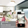 A family is having dinner in a modern kitchen, with a smartphone in the foreground capturing the scene. Voir les images du produit