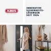 A woman is opening a door, and the top part of the image shows marketing text and a logo. Produktbild-Vorschau