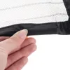 A hand is holding the edge of a black fabric border attached to a mesh material. Náhled obrázku produktu