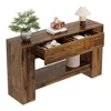 A wooden console table with two drawers and a lower shelf, decorated with a plant, books, a toy car, and a lamp. Produktbild-Vorschau