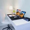 A desk setup with a laptop, tablet, lamp, and external hard drive. Náhled obrázku produktu