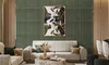 A living room scene with a sofa, coffee table, and artwork on a patterned wall. Produktbild-Vorschau