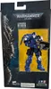 The image shows the packaging of a Warhammer 40,000 action figure, specifically an Ultramarines Reiver with Bolt Carbine. The packaging features artwork of a character on the left and a window displaying the action figure on the right, set against a yellow Anteprima dell’immagine prodotto