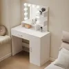 A white vanity table with LED lights and a mirror, set against a light beige wall. Náhled obrázku produktu