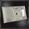 A stainless steel kitchen sink with a draining board. Produktbild-Vorschau