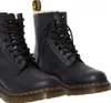 A pair of black Dr. Martens boots. Podgląd zdjęcia produktu