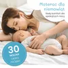 A mother kissing her baby while lying on a mattress. Produktbild-Vorschau