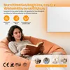 A woman is reading a book while sitting on a beanbag chair, with a wall-mounted heater visible in the background. The image includes marketing text and icons. Produktbild-Vorschau