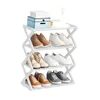 A white shoe rack filled with various shoes and two decorative boxes on the top shelf. Anteprima dell’immagine prodotto