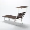 A studio shot of a chaise lounge chair with a canopy. Anteprima dell’immagine prodotto