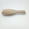 A single gold hairbrush is shown against a white background. Anteprima dell’immagine prodotto