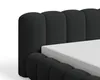 A close-up view of a black upholstered bed frame with a white mattress. Voir les images du produit