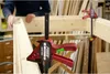 A person is using a Piher Quick Einhandzwinge Extra 60 cm clamp to hold wooden beams together in a workshop setting. Náhled obrázku produktu