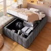A bed with storage is shown in a bedroom setting, with items stored inside the bed frame. Voir les images du produit