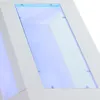 A close-up view of a modern white coffee table with a glass top and blue LED lighting. Voir les images du produit