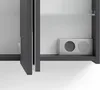 A close-up view of the interior of a cabinet, showing a shelf and a small metallic component with two circular openings. Náhled obrázku produktu