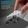 A hand is shown applying a clear camera lens protector to a smartphone. Produktbild-Vorschau