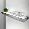 A modern shelf with integrated LED lighting, displaying two coffee cups and a small decorative plant. Produktbild-Vorschau