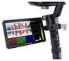 A close-up shot of a Feelworld monitor attached to a gimbal or camera rig, displaying a castle scene and various visual data. Produktbild-Vorschau