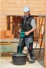 A construction worker is mixing material in a bucket with a power mixer. Produktbild-Vorschau