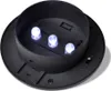 The image shows the underside of a black outdoor solar light with three white LED lights illuminated. Produktbild-Vorschau