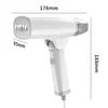 A white and gray handheld garment steamer with dimensions indicated. Produktbild-Vorschau