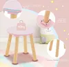 A collage of close-up shots of a pink children's stool, highlighting its features like rounded edges, reinforced connections, and wooden legs. Podgląd zdjęcia produktu