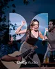 People enjoying music and drinks outdoors at night, with a Dolby Audio logo overlay. Produktbild-Vorschau