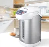 A water boiler is shown on a kitchen counter next to a cup of coffee and a donut. Náhled obrázku produktu