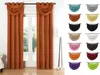 A display of various colored curtains and swatches of fabric. Produktbild-Vorschau