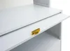 A close-up view of a white kitchen cabinet with a gold handle and a pull-out shelf. Anteprima dell’immagine prodotto