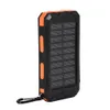 A black and orange solar power bank with a carabiner clip attached. Voir les images du produit
