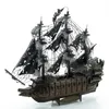 A 3D metal model of a pirate ship with tattered black sails, displayed on a white background. Náhľad obrázku produktu