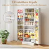 A tall white kitchen cabinet filled with various food items and kitchenware, with a plant in a pot to the left. Produktbild-Vorschau
