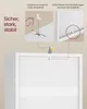 A close-up view of a white cabinet with marketing graphics and text explaining safety features. Produktbild-Vorschau