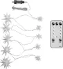 A string of star-shaped LED lights and a remote control are laid out on a white background. Produktbild-Vorschau