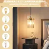 A modern bedroom with a pendant light hanging over a nightstand. Anteprima dell’immagine prodotto