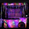 A decorated cart with colorful lights at night. Produktbild-Vorschau