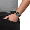 A person wearing a watch on their wrist. Produktbild-Vorschau