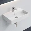 A white rectangular sink mounted on a light gray wall, with a chrome faucet and drain. Anteprima dell’immagine prodotto