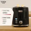 A black toaster with two slices of bread in it, placed on a wooden surface. Text overlays describe its features. Podgląd zdjęcia produktu