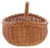 A woven basket with a handle, presented against a white background. Produktbild-Vorschau