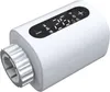 A white smart thermostat head with a digital display and a silver dial. Náhľad obrázku produktu