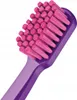 Close-up of a purple toothbrush with pink bristles. Náhled obrázku produktu