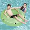 Two people are in a swimming pool, one boy is sitting in a green inflatable ring and a woman is behind him. Náhľad obrázku produktu