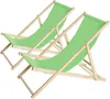 Two green deck chairs made of wood, shown from a diagonal angle against a white background.