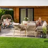 A couple relaxing on a patio with outdoor furniture. Náhľad obrázku produktu