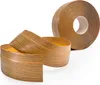 Two rolls of wood-effect plastic trim, one partially unrolled, against a white background. Anteprima dell’immagine prodotto